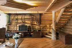 Современный дизайн интерьера дома из оцилиндрованного бревна